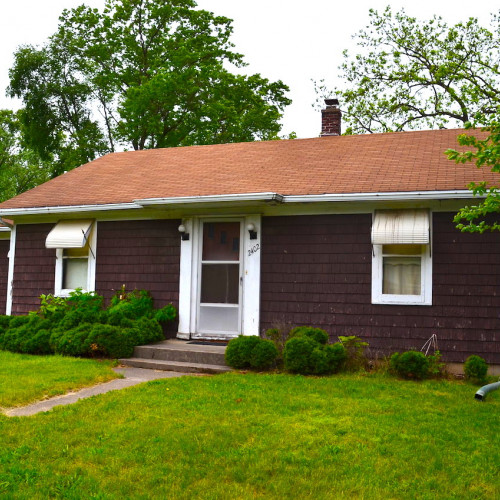 Investment 3 bedroom home with garage on a large corner lot